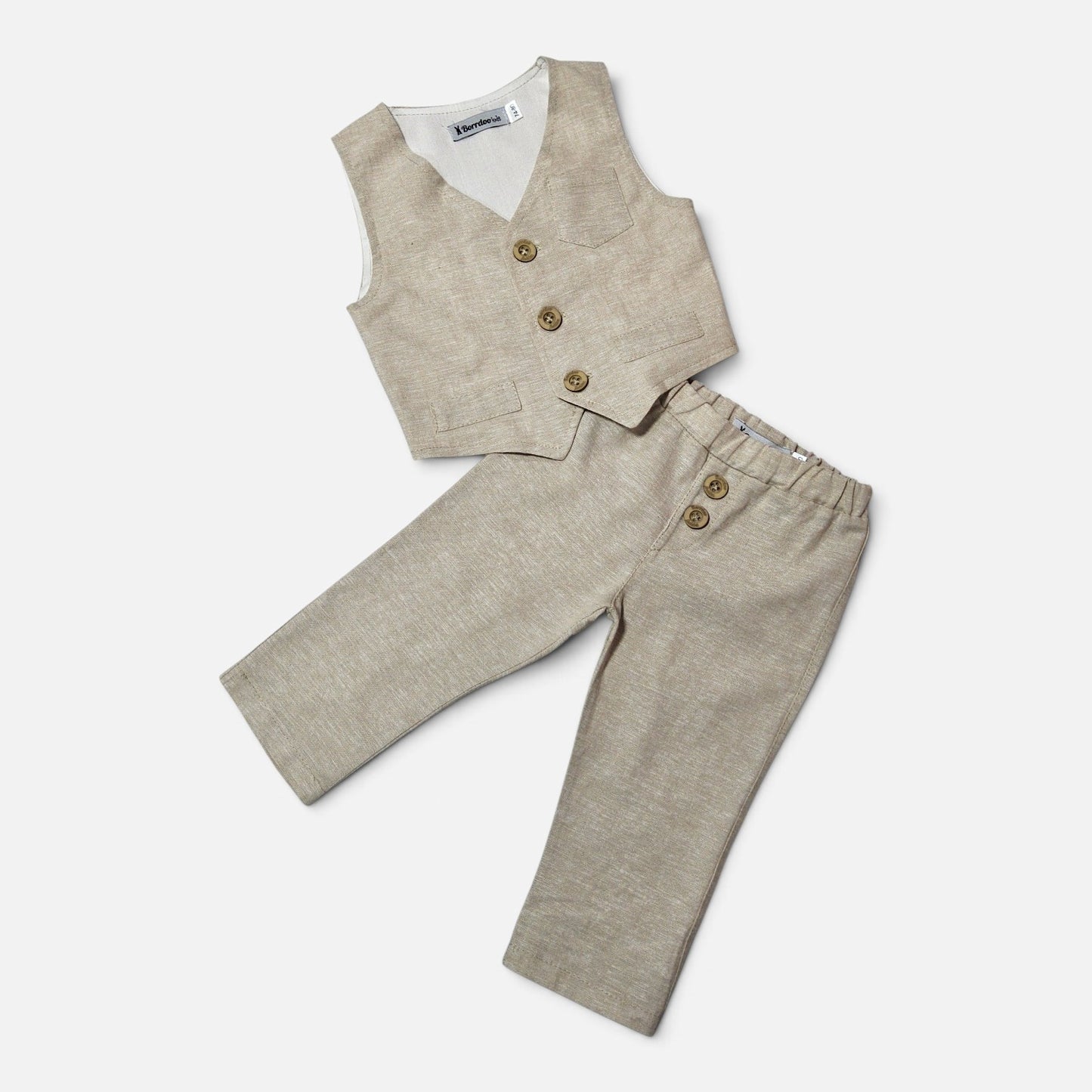 A two-piece children's outfit set featuring light beige linen trousers with three front buttons and a matching linen vest with three front buttons, laid flat on a light gray background.